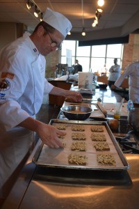 François Brandt egg washing and encrusting the Speculos Cookies with slivered almonds